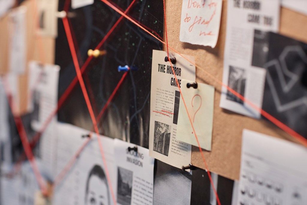 An evidence board with red string