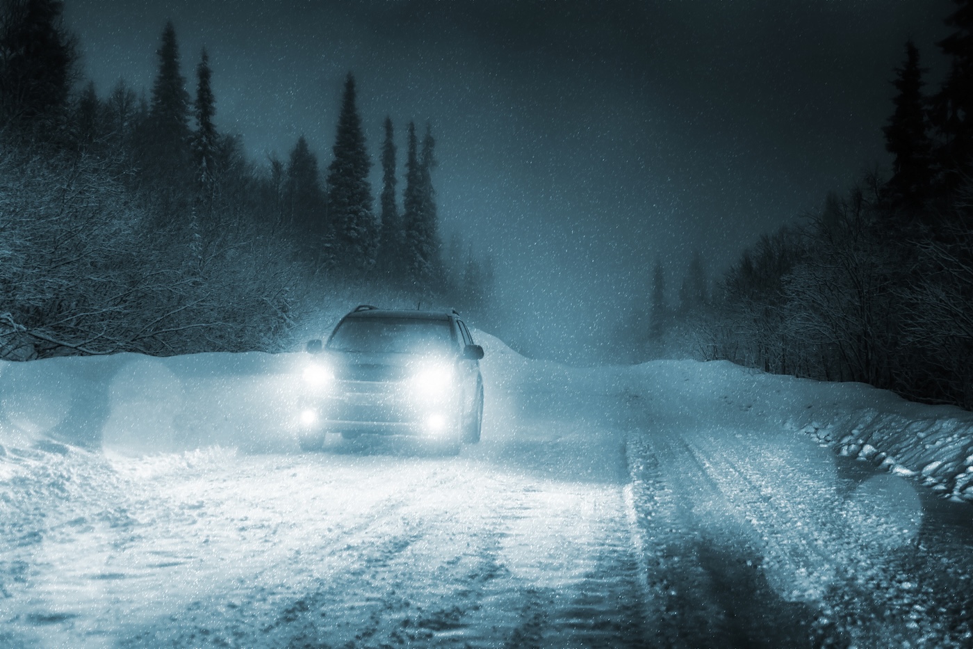A cold car on a snow covered road