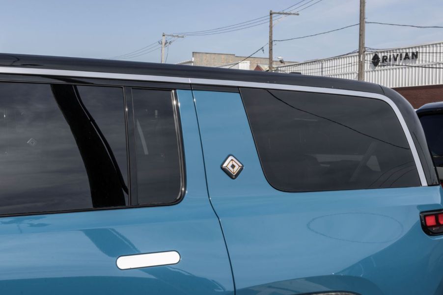 The rear quarter panel of a Rivian R1S