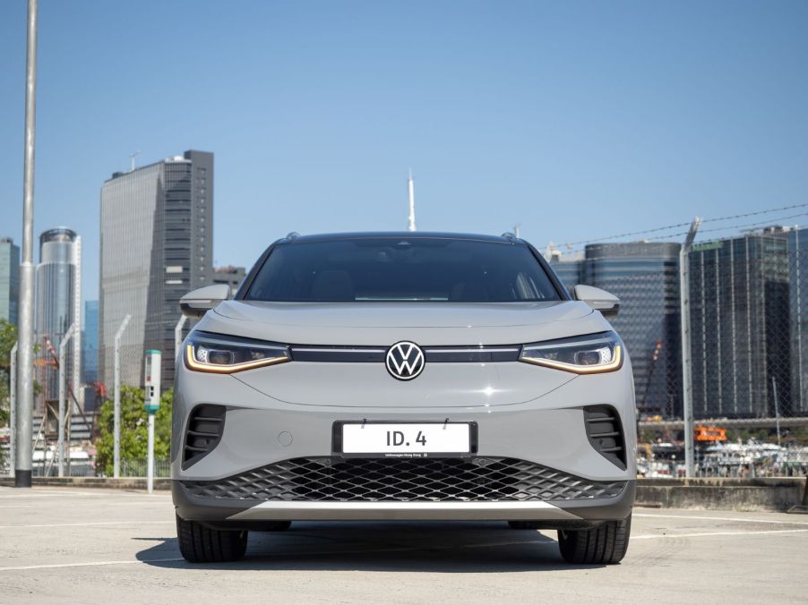 A VW ID.4 photographed from the front, showing off the front grille and headlights