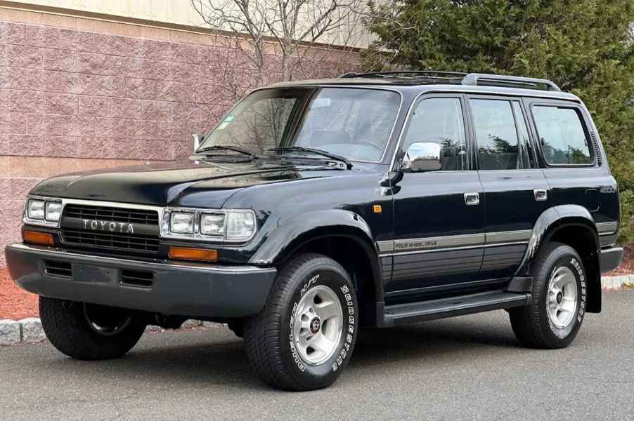 A black 1995 Toyota Land Cruiser parked in left front angle view
