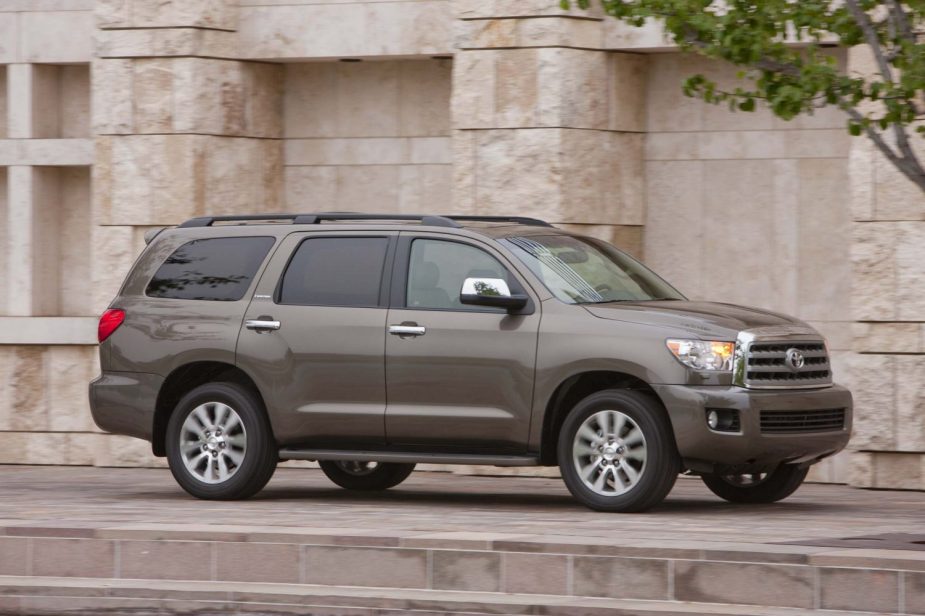 A brown metallic 2017 Toyota Sequoia parked in right side angle view