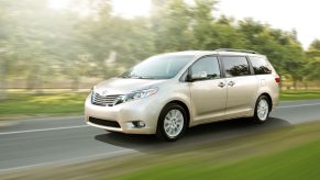 A gold 2017 Toyota Sienna driving