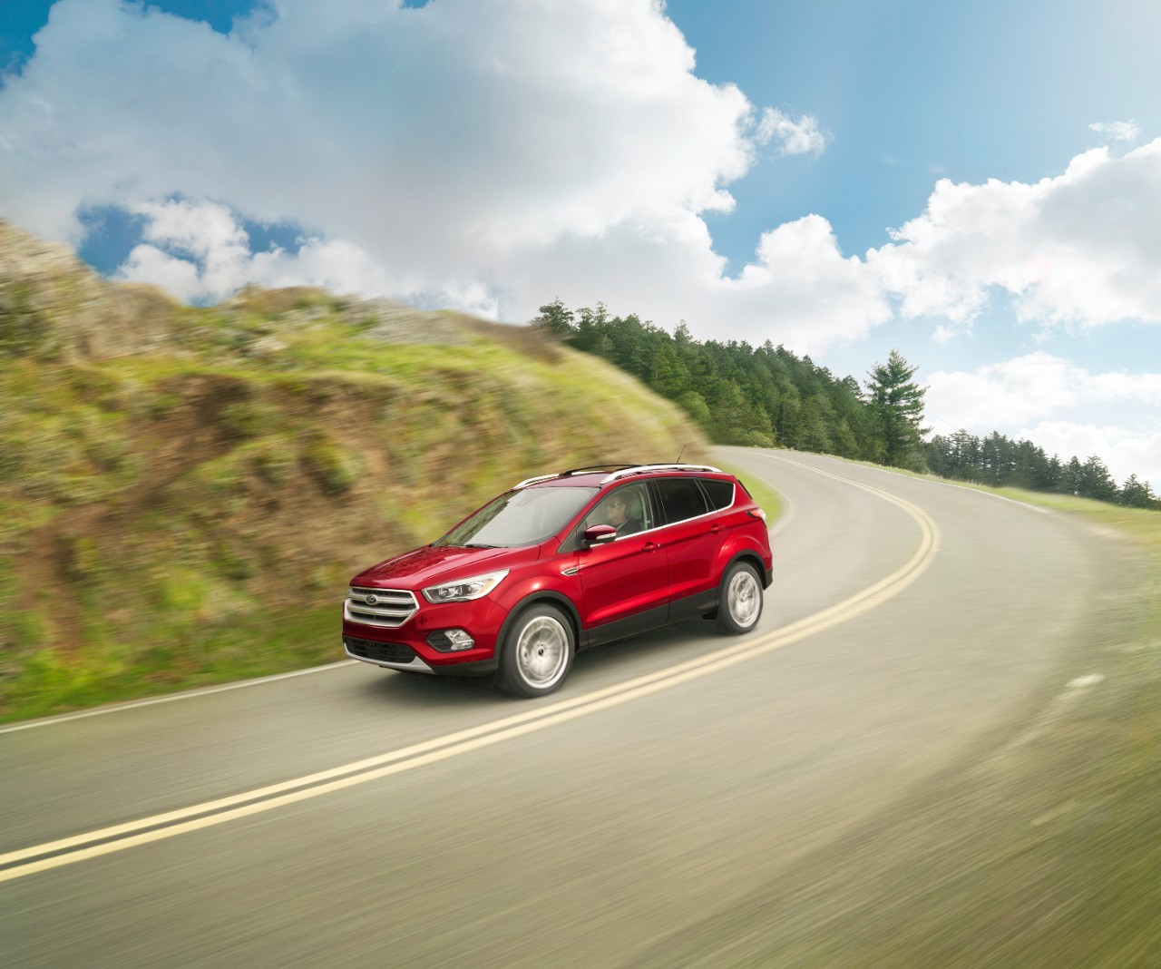A red 2018 Ford Escape driving