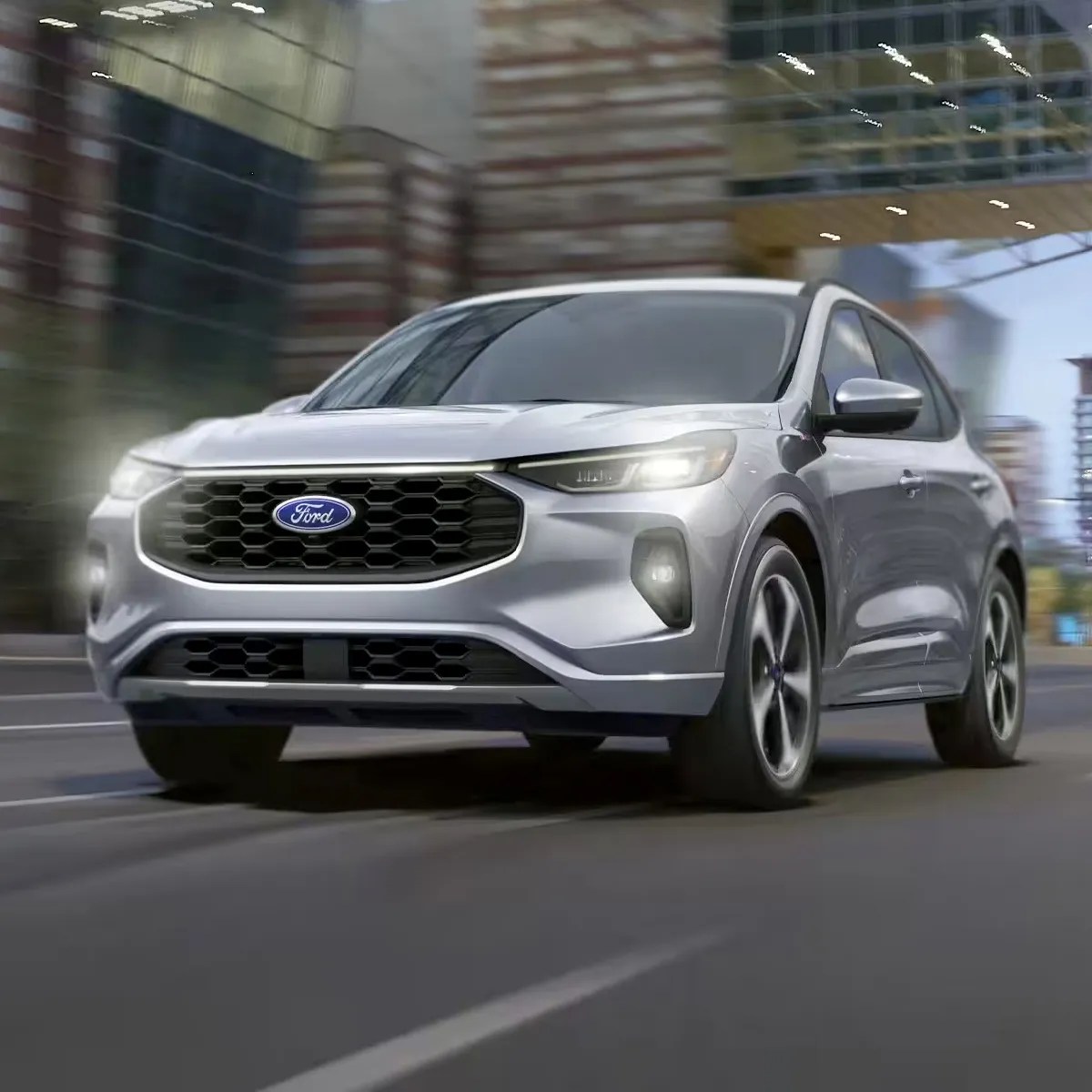 The 2024 Ford Escape driving in the city 