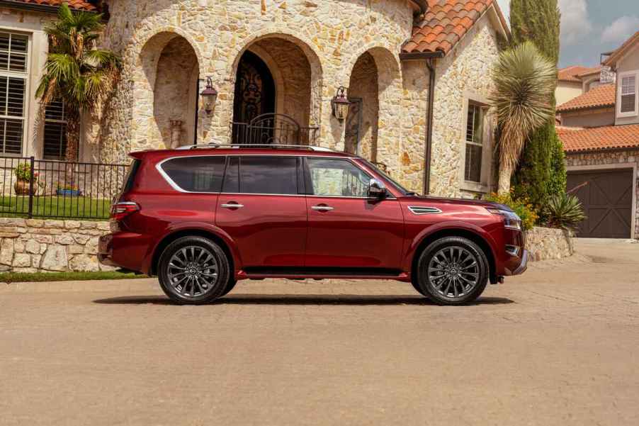 A red 2024 Nissan Armada parked in full right profile view the vehicle is considered one of the fastest-depreciating SUVs in the U.S. market in 2025