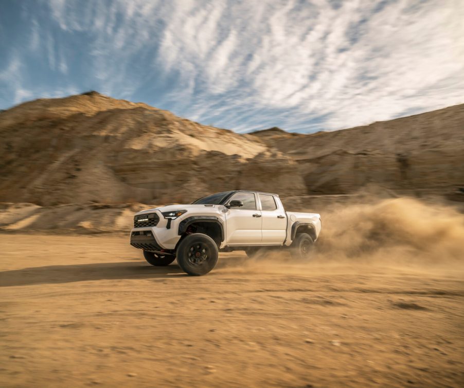 A white 2025 Toyota Tacoma TRD Pro kicking up dust - the Tacoma is one of the trucks that retains the most value after five years in 2025