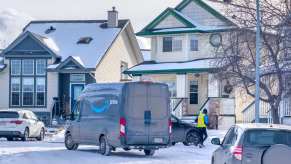 An Amazon delivery van in the snow.
