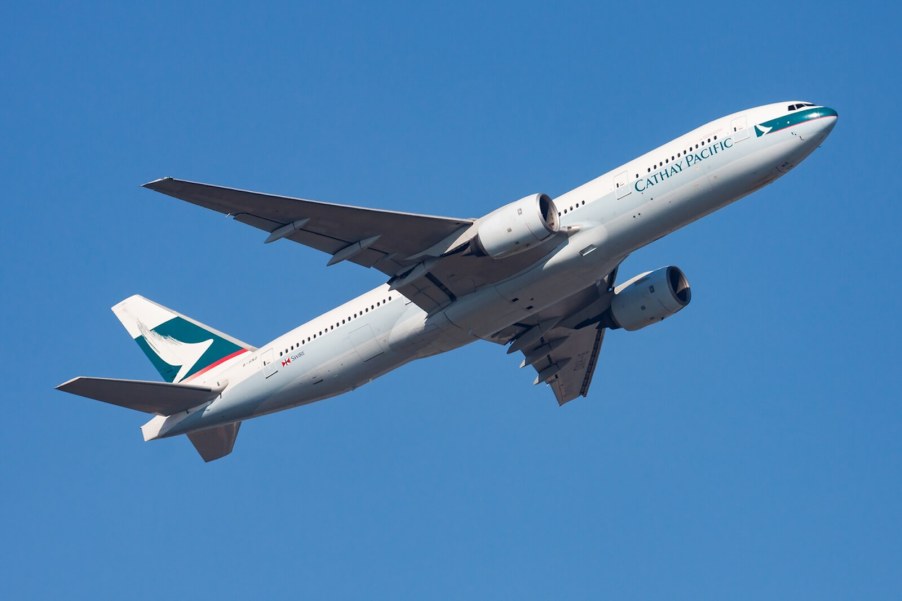 A Cathay Pacific flight takes off to fly to LAX.