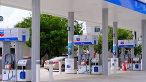 A Chevron gas station with pumps, keypads, and credit card skimmers.