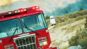 A fire truck half-way off the road.