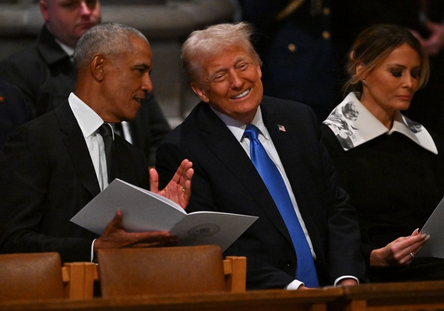 Trump sitting beside Obama