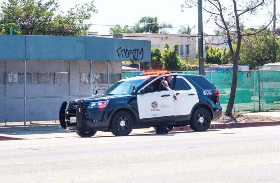 An LAPD SUV responds to LA crime on the side of a busy road.