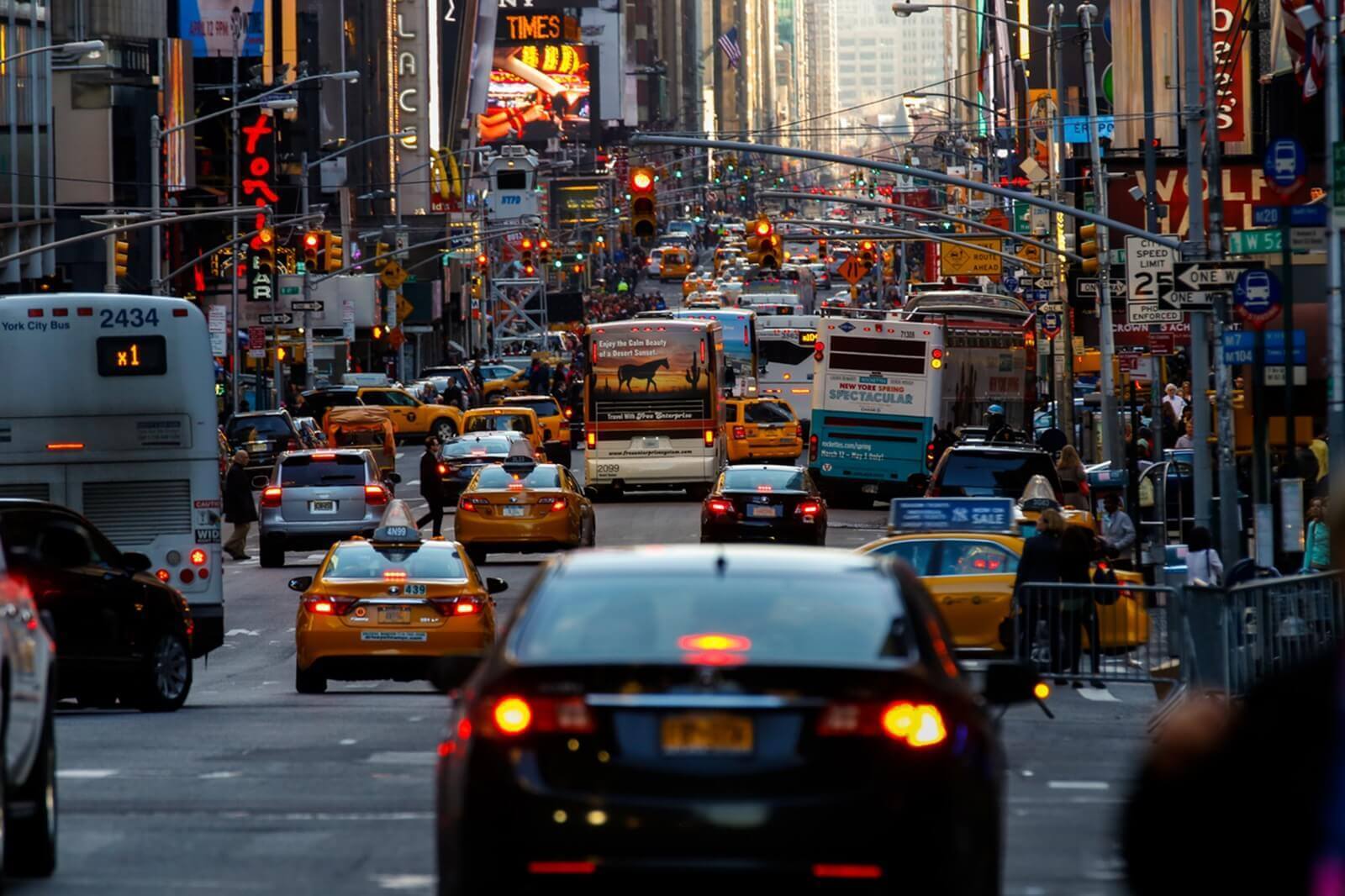 Traffic waiting between skyscrapers in Manhattan