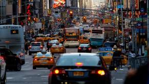 Traffic waiting between skyscrapers in Manhattan