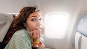 A horrified passenger on a major commercial flight like United Airlines or Delta.
