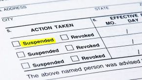 A document shows a suspended driver's license following a DUI charge.