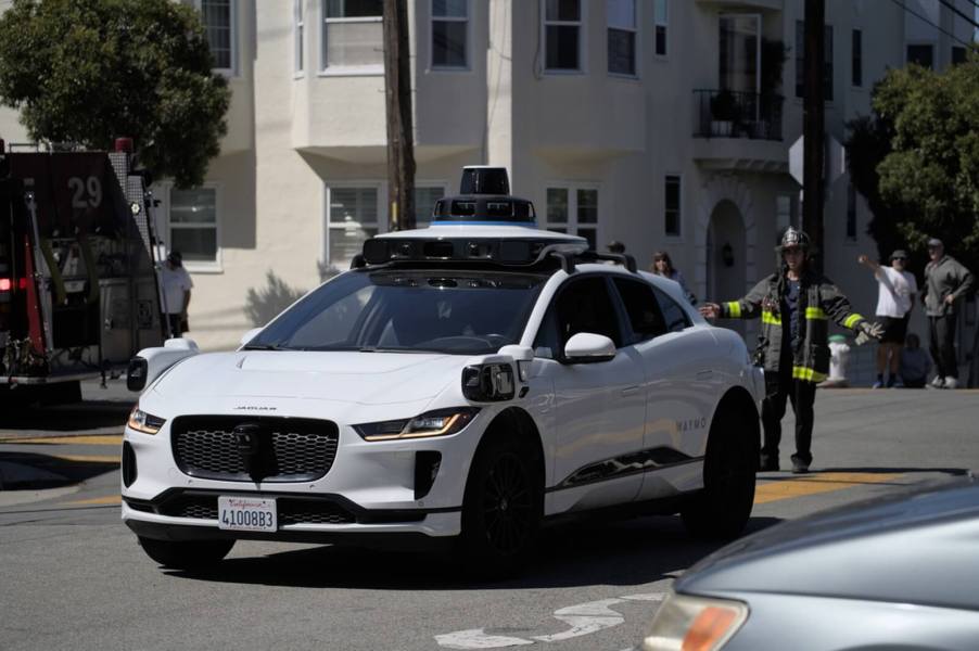 A Waymo driverless car drives in San Francisco.
