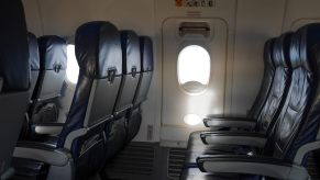 Airplane emergency exit door view from cabin