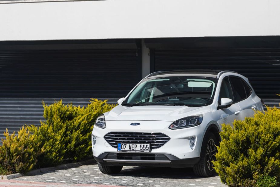 A Ford Escape parked in a scenic driveway