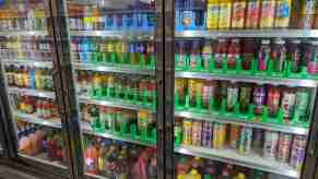 Drinks inside a glass-front commercial refrigerator at a gas station