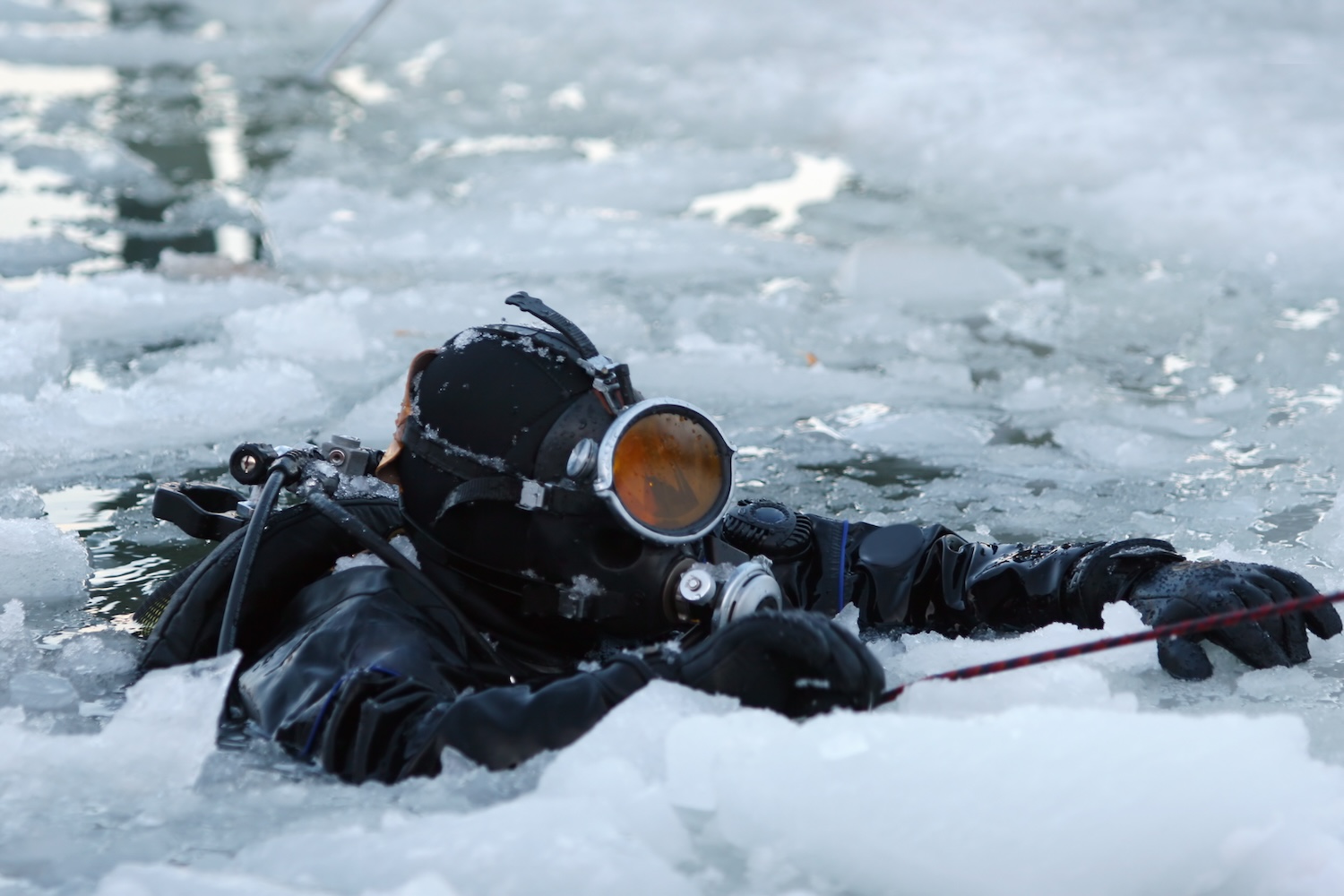 A diver in a frozen lake