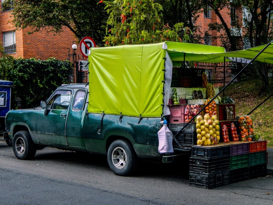 A man selling produce out of truck