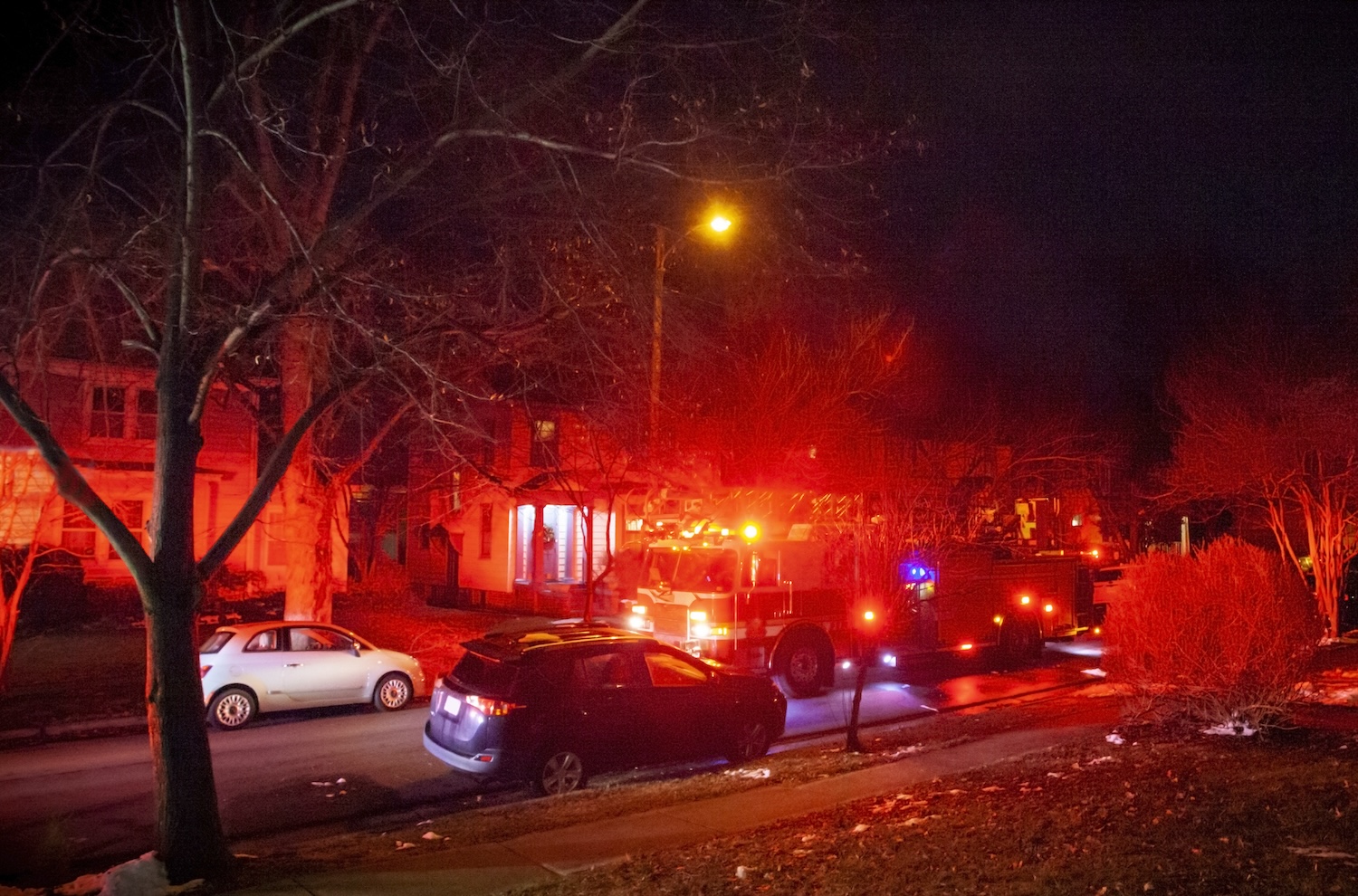 A firetruck responding to an emergency in a neighborhood 