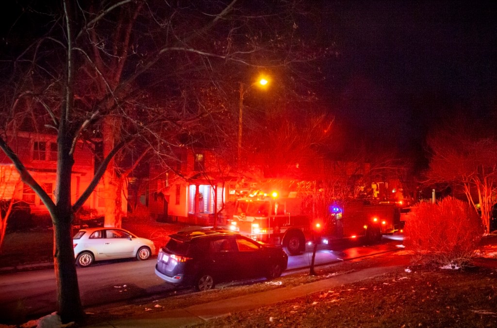 A firetruck responding to an emergency in a neighborhood