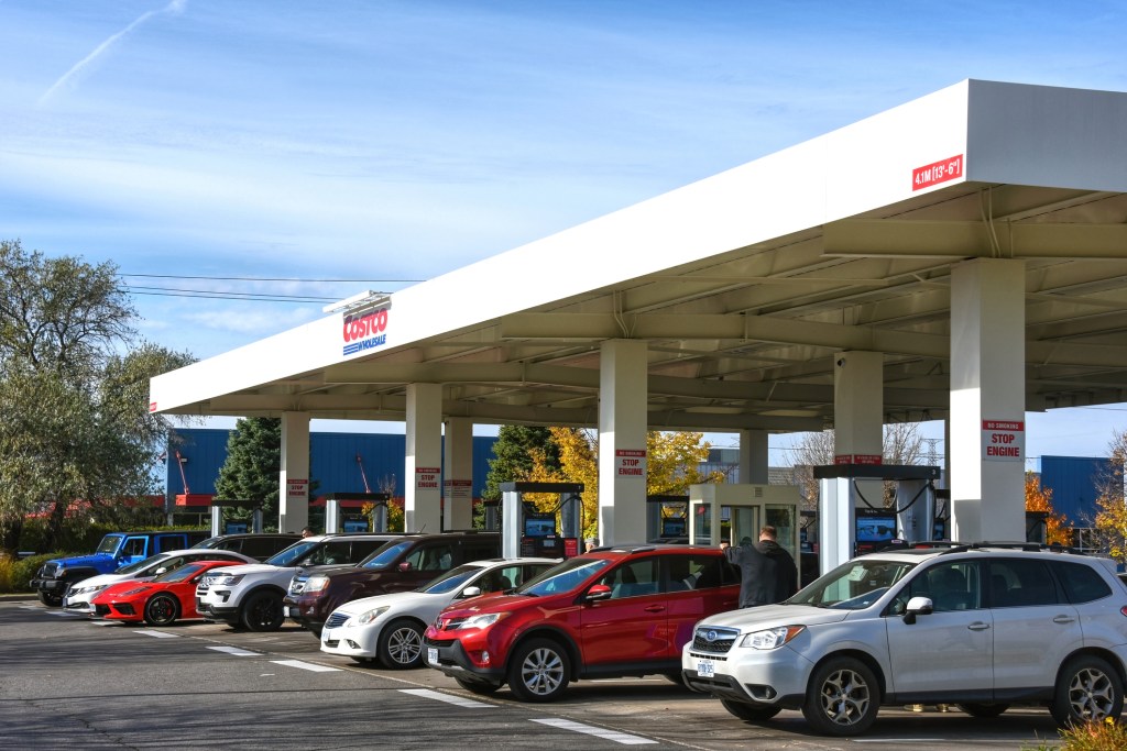 Cars lined up for gas at a gas station