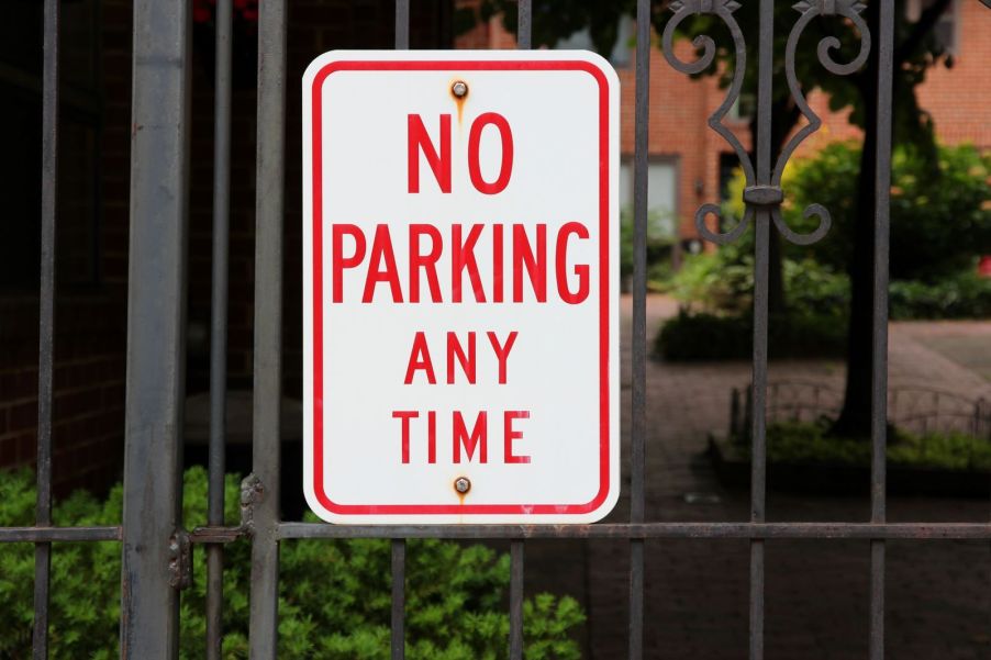 A sign on a private gate that reads "No Parking Any Time"