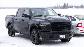 A 2024 Ram 1500 pickup truck parked on a frozen lake
