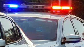 A police car pulling over a passenger car for a traffic stop