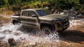 The 2025 Toyota Tacoma fording a stream