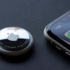 An Apple AirTag next to an iPhone