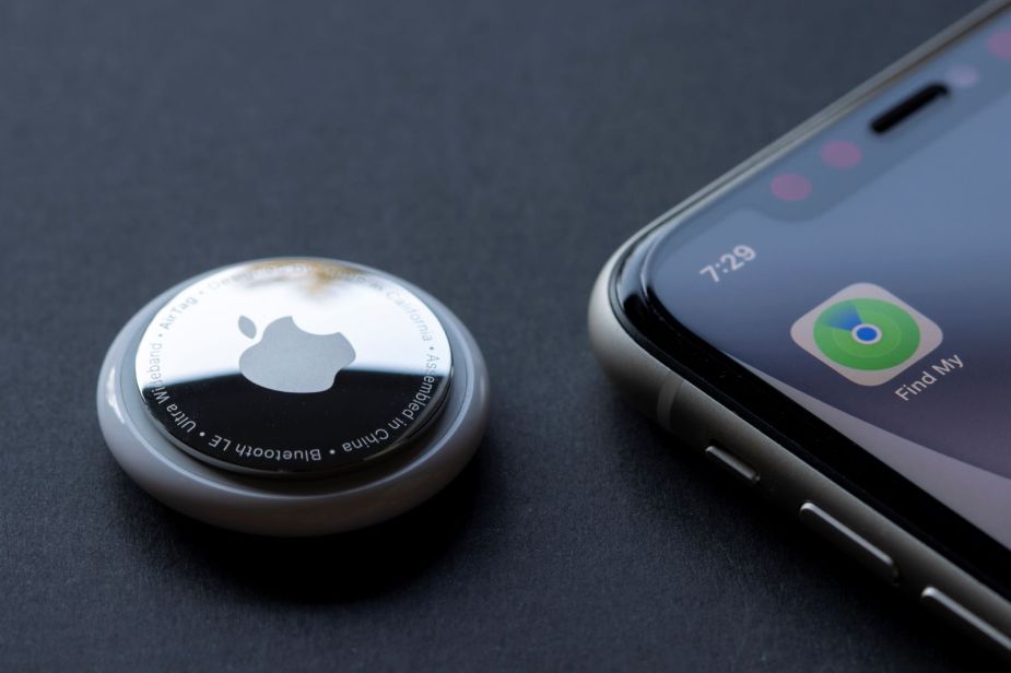 An Apple AirTag next to an iPhone