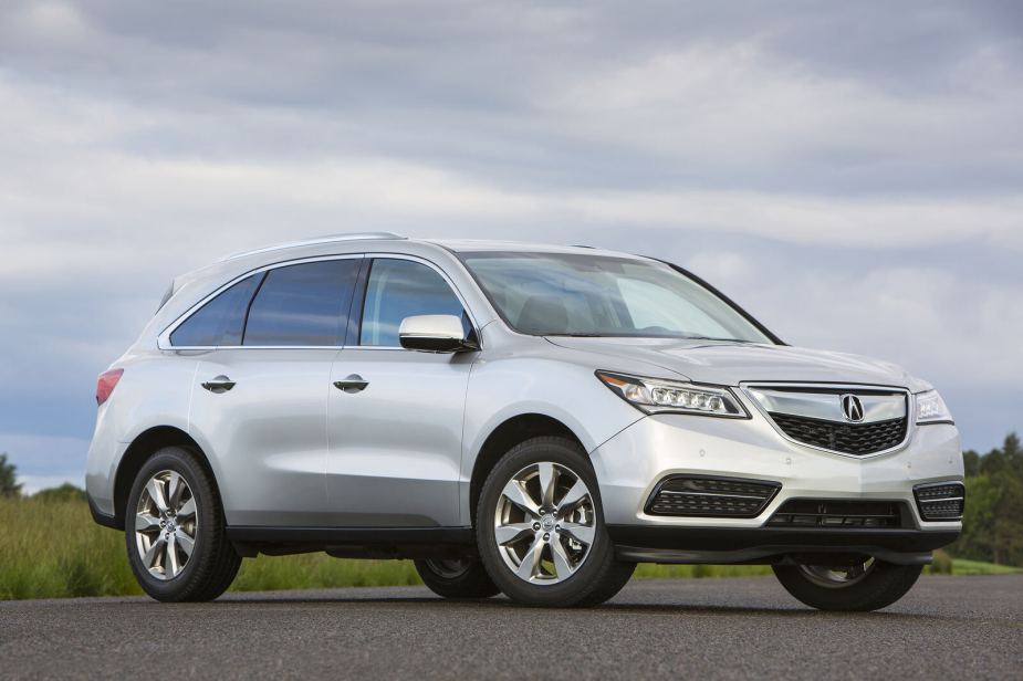 A silver 2016 Acura MDX parked in right front angle view