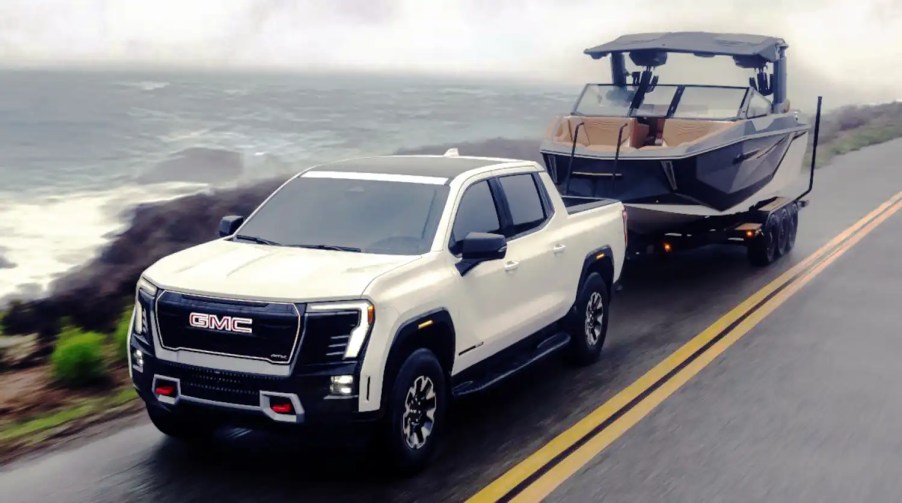 The 2026 GMC Sierra EV AT4 towing a boat