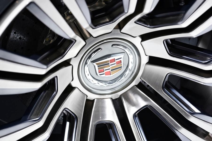 The Cadillac logo in the center of an electric concept sedan wheel.