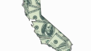 The shape of the state of california out of $100 bills to represent the high gas tax.