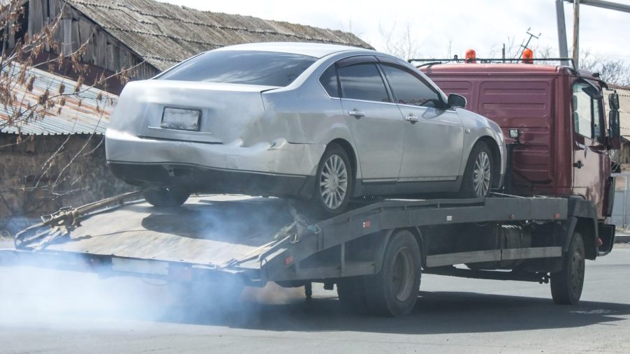 A repo truck driver sustained injuries in Memphis after being run over while trying to take a car.
