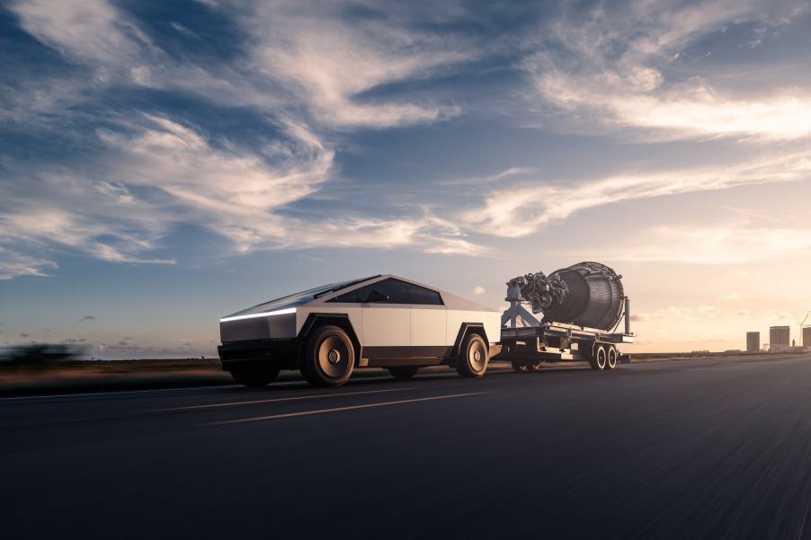 A Tesla Cybertruck, one of Elon Musk's controversial EVs, tows a rocket engine.