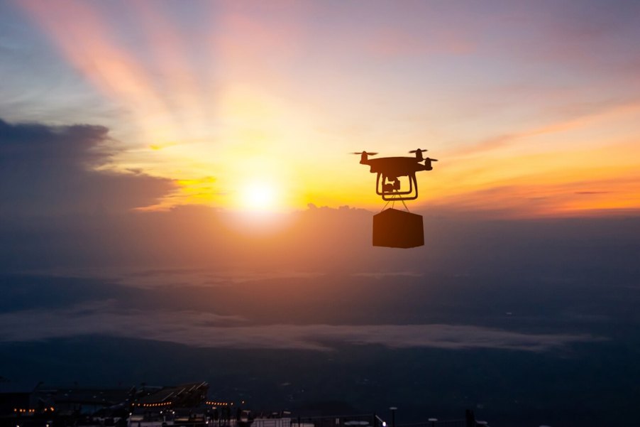 A drone carries a car battery on a delivery flight, just like the one that dropped the battery on a Ford SUV.