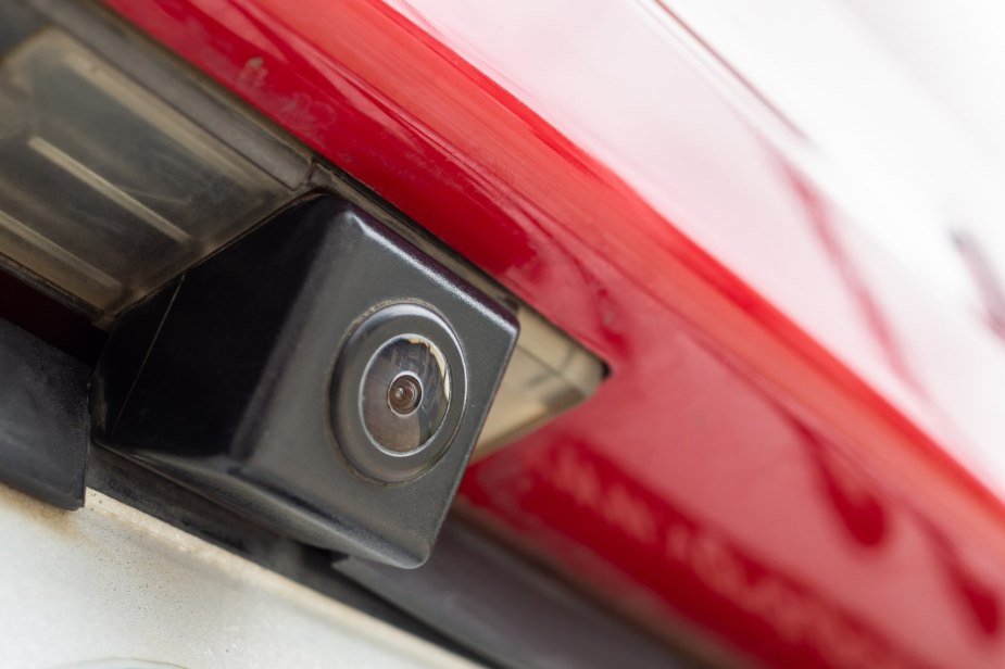 Red Ford Escape crossover's backup camera which is subject to a recall.