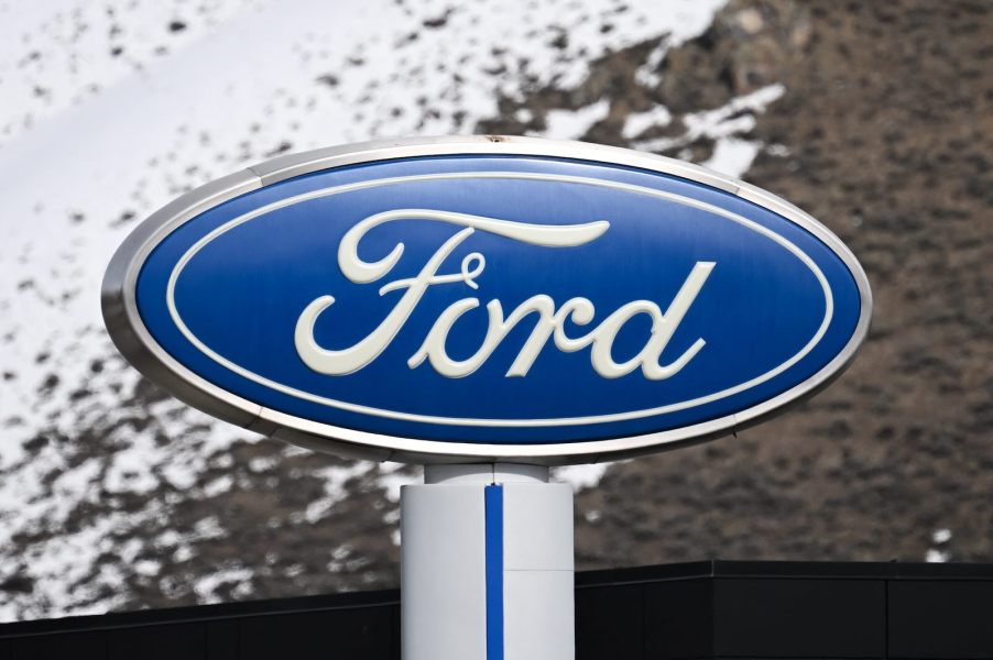 Ford logo sign above a dealership.