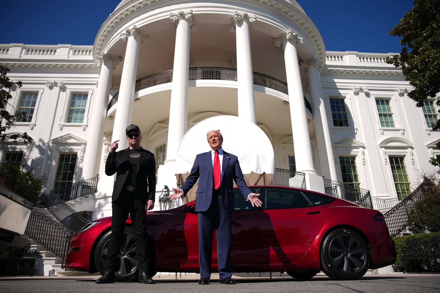 Elon Musk and Trump in front of Tesla Model S