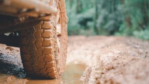 Muddy pickup truck in the woods during a Louisiana trail ride