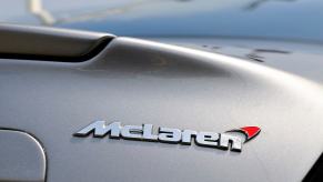 McLaren badge on a silver sports car, soon to be on an SUV