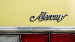 Yellow Mercury Marquis sedan trunk.