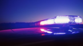 The lights atop an Ohio police cruiser during a chase at night.